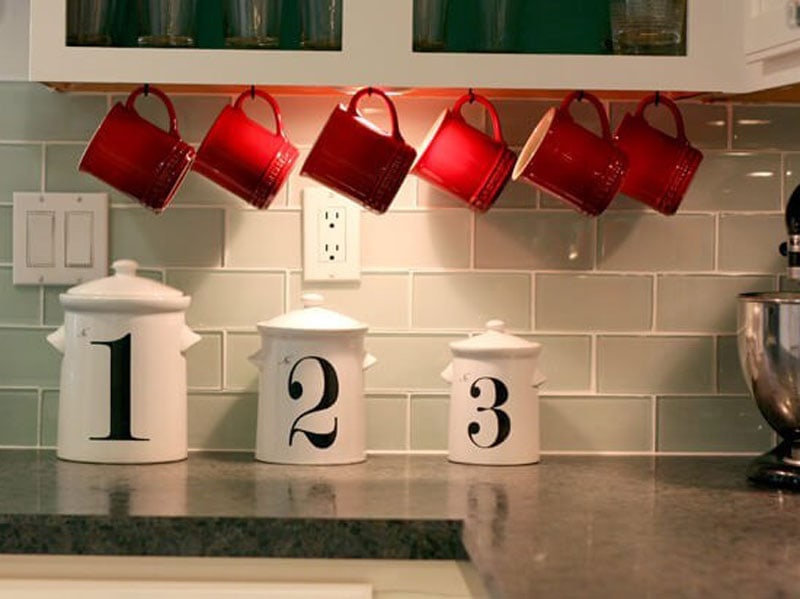 Mount hooks under a cabinet for easy access