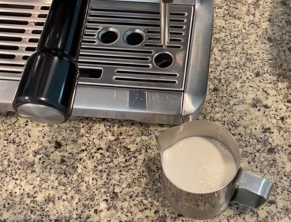 Prepare to steam milk with Breville Barista Express