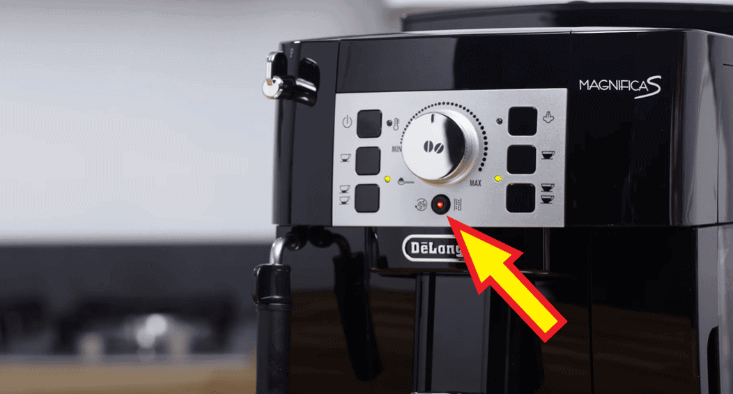 Pressing the descaling button will start the cleaning process on Delonghi model