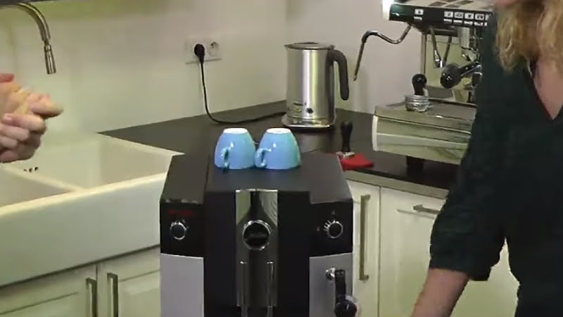 Jura C65 has a cup warmer on the top of the machine